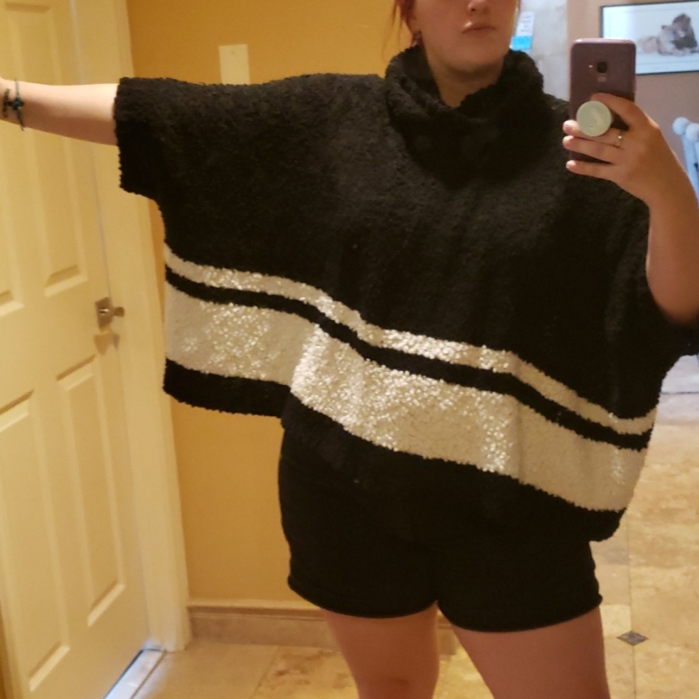 A Romeo and Juliet Couture sweater poncho